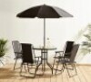 1 X STUDIO OXFORD 6 PIECE PATIO GARDEN SET IN BLACK TO INCLUDE PARASOL , 4 FOLDABLE CHAIRS AND ONE TABLE IN ONE BOX (NOTE CUSTOMER RETURNS )
