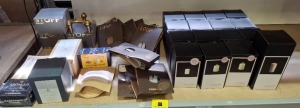 34 X BRAND NEW MIXED LOT CONTAINING NAGEL CANDLESTICK 3 PIECES BRASS , GEORG JENSEN STAINLESS STEEL CANDLEHOLDER , LINDDNA LOOP NAPKIN HOLDERS , UYUNI LIGHTING FLAMELESS LED BATTERY OPERATED PILLAR CANDLES IN SIZE 3 X 4 INCH ON HALF A SHELF