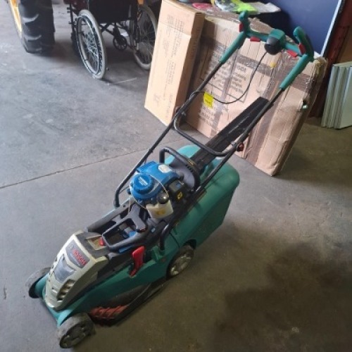 2 X GARDENING LOT CONTAINING 1 ELECTRIC BOSCH ROTAK 37 - 36 LI ERGO - NO BATTERY NO CHARGER - AND ONE HYUNDAL PETROL HEDGE TRIMMER - CORD IS STUCK