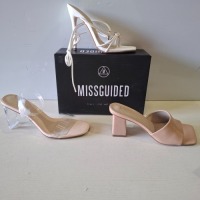 30 X BRAND NEW MIXED MISSGUIDED SHOES CONTAINING SQUARE TOE BLOCK HEEL MULE SANDALS IN SAND , MID ILLUSION HEEL CLEAR SANDALS IN CLEAR , WF SATIN POINTED LACE UP BARELY THERE IN BLACK ETC ALL IN SIZE 4