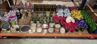 FULL BAY OF BRAND NEW PREMIER LOT CONTAINING SQUIRREL ORNAMENT , 4 - 1 LED SOLAR POWERED FLICKERING FLAME TORCHES , SQUARE COLUMN OIL BURNER , MUSHROOM ORAMENT , THE OUTDOOR LIVING CITRONELLA CANDLES , VARIOUS ARTIFICIAL DECORATIVE PLANTS ETC ON A FULL BA