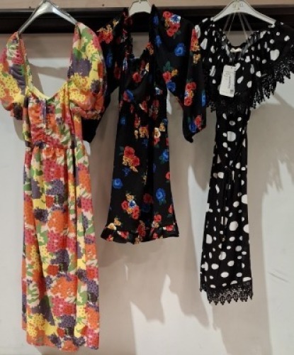 18 X WOMENS DRESSES TO INCLUDE SUFFLE DRESS IN BLACK AND SILVER IN SIZE M , DYD DRESS IN POLKA DOT WHITE AND BLACK IN SIZE , 36 , ACTUEL DRESS IN ORANGE AND BROWN IN SIZE L ETC ON A RACK