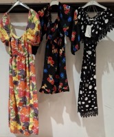 18 X WOMENS DRESSES TO INCLUDE SUFFLE DRESS IN BLACK AND SILVER IN SIZE M , DYD DRESS IN POLKA DOT WHITE AND BLACK IN SIZE , 36 , ACTUEL DRESS IN ORANGE AND BROWN IN SIZE L ETC ON A RACK