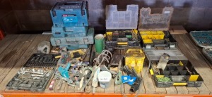 HALF A BAY OF MIXED BUILDERS TOOLS LOT CONTAINING PORTABLE TRANSFORMER , PADDLE MIXER , SOCKET SET , VARIOUS NUTS AND BOLTS AND SCREWS , EMPTY MAKITA TOOL BOXES ETC ON HALF A BAY