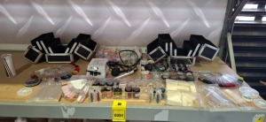 LARGE QUANTITY OF NAIL ACCESSORIES LOT CONTAINING VARIOUS POTS OF GLITTER , PROFESSIONAL ELETRIC NAIL FILE , PROFESSIONAL MAKEUP CASE , NAIL POLISH SWATCH STICKS , ETC ON HALF A SHELF