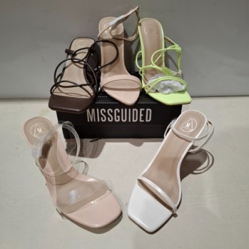 30 X BRAND NEW PAIRS OF MIXED MISSGUIDED SHOES CONTAINING MID CLEAR HEEL BLOCK HEEL IN NUDE , MID ILLUSION HEEL CLEAR SANDALS IN CLEAR , BARELY THERE LOW HEEL SANDALS IN WHITE , SQUARE TOE STRAPPY TIE UP MID HEELS IN CHOCOLATE ETC ALL IN SIZE 5