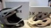 2 X PIECE BRAND NEW BIKE HELMET LOT CONTAINING 1 X FOX RAMPAGE BIKE HELMET IN BARGE / CLOUD GREY IN SIZE LARGE - RRP &pound;210 - 1 X SPEEDFRAME 5050 HELMET IN SIZE LARGE CREAM - RRP &pound;105 - TOTAL RRP FOR LOT &pound;315