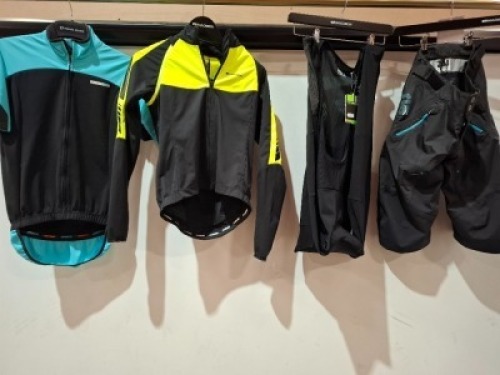 12 X BRAND NEW MIXED CLOTHING LOT CONTAINING FOX JEANS IN SIZE 32 , MADISON JACKET IN BLACK / GREEN IN SIZE 8 , MADISON ROAM MEN'S DWR CARGO BIB TIGHTS IN BLACK IN SIZE XL , VARIOUS MADISON / FOX SHORTS IN BLACK / GREY IN SIZE 8 , SMALL , 30 , 28 ETC