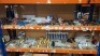 100 + MIXED UPVC WINDOW AND DOOR HARDWARE LOT CONTAINING VARIOUS KITCHEN CABINET DOOR HANDLES , SOUDAL SILIRUB NEUTRAL SILICONE , VARIOUS DOOR HANDLES , VARIOUS TOOLS SCREWDRIVERS HAMMERS ETC OVER TWO SHELVES