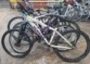 5 X MIXED BIKES LOT TO INCLUDE 1 KONA BIKE IN WHITE IN SIZE 40CM , 1 NORTHERN CASCADE MAGNA BIKE IN PURPLE/TEAL IN SIZE 47CM , 1 MERIDA BIKE IN WHITE IN 52CM , 1 BOSS BLADE BIKE IN BLACK AND GREEN IN SIZE 46CM , AND 1 RALEIGH BIKE WITH BIKE LOCK IN WHITE 
