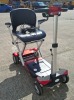 NEXT GEN AUTO PLUS FOLDABLE MOBILITY SCOOTER IN RED WITH BATTERY & CHARGER RRP &pound;2995 CONDITION: VERY GOOD (TESTED WORKING & SEE ALL IMAGES FOR CONDITION)