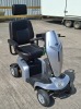 KYMCO UK KOMFY 4 MOBILITY SCOOTER IN SILVER (MODEL: EQ30FA(UK) ) WITH BATTERY & CHARGER 25 MILES RANGE - MAX SPEED 4 MPH CONDITION: GOOD (TESTED WORKING & SEE ALL IMAGES FOR CONDITION)