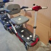 2 X DRIVE DEVILBISS MANUAL FOLDING SCOOTERS - RED & BLUE BOTH WITH KEYS & BATTERIES NO CHARGER IGNITION POWERS UP ON BOTH DRIVE DOES NOT ENGAGE CONDITION OF BOTH: FAIR - 2