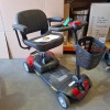 3 X MOBILITY SCOOTERS IE. 1 X DRIVE DEVILBISS CMS001RD CAR BOOT MODEL IN RED WITH KEY & BATTERY, NO CHARGER IGNITION POWERS UP BUT DRIVE DOES NOT ENGAGE 1 X FREERIDER LUGGIE POWER CHAIR IN RED WITH BATTERY, NO CHARGER IGNITION POWERS UP BUT DRIVE DOES NOT - 4