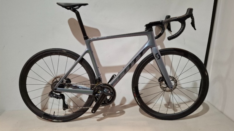 SCOTT ADDICT RC 15 ROAD BIKE IN GREY CODE: 290358 SIZE: L ORIG RRP &pound;6199 (+ PREMIUM FOR ADDITIONAL ENG WORK) ADDICT RC DISC HMX CARBON FRAME ADDICT RC HMX FORK SHIMANO ULTEGRA DI2 DISC 24 SPEED SCHWALBE ONE RACE-GUARD TYRES STEERERS HAVE BEEN CUT OUT (STA