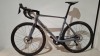 SCOTT ADDICT RC 15 ROAD BIKE IN GREY CODE: 290358 SIZE: L ORIG RRP &pound;6199 (+ PREMIUM FOR ADDITIONAL ENG WORK) ADDICT RC DISC HMX CARBON FRAME ADDICT RC HMX FORK SHIMANO ULTEGRA DI2 DISC 24 SPEED SCHWALBE ONE RACE-GUARD TYRES STEERERS HAVE BEEN CUT OUT (STA - 2