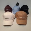 60 X BRAND NEW MENNACE LOGO BASEBALL CAPS IN VARIOUS COLOURS BLUE , BROWN , BLACK , OFF WHITE AND MAUVE IN TWO TRAYS - 2