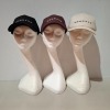 60 X BRAND NEW MENNACE LOGO BASEBALL CAPS IN VARIOUS COLOURS BLUE , BROWN , BLACK , AND MAUVE IN TWO TRAYS