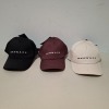 60 X BRAND NEW MENNACE LOGO BASEBALL CAPS IN VARIOUS COLOURS BLUE , BROWN , BLACK , AND MAUVE IN TWO TRAYS - 2