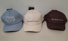 60 X BRAND NEW MENNACE LOGO BASEBALL CAPS IN VARIOUS COLOURS BLUE , BROWN , BLACK , OFF WHITE AND MAUVE IN TWO TRAYS - 2
