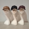 60 X BRAND NEW MENNACE LOGO BASEBALL CAPS IN VARIOUS COLOURS BLUE , BROWN , BLACK AND MAUVE AND MAUVE IN TWO TRAYS