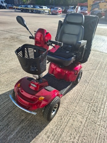 FREERIDER KENSINGTON MOBILITY SCOOTER IN RED WITH RAIN COVER - WITH BATTERY & CHARGER 25 MILE RANGE - MAX SPEED 8 MPH RRP &pound; 2,195 CONDITION - FAIR SOME SCRATCHES (TESTED WORKING & SEE ALL IMAGES FOR CONDITION )
