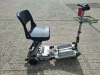 LUGGIE FOLDING MOBILITY SCOOTER IN GREY TAUPE NO CHARGER - TESTED WORKING WITH CHARGE REMAINING IN BATTERY CONDITION GOOD ( SEE ALL IMAGES FOR CONDITION ) - 5