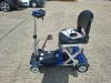 AUTO - FOLD 4 WHEEL ELECTRIC SCOOTER IN BLACK / BLUE WITH CHARGER - TESTED WORKING WITH CHARGE REMAINING IN BATTERY CONDITION GOOD ( SEE ALL IMAGES FOR CONDITION ) - 6