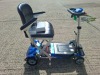 AUTO - FOLD 4 WHEEL ELECTRIC SCOOTER IN BLACK / BLUE WITH CHARGER - TESTED WORKING WITH CHARGE REMAINING IN BATTERY CONDITION GOOD ( SEE ALL IMAGES FOR CONDITION ) - 5