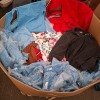 200 X BRAND NEW MIXED CRIMINAL DAMAGE CLOTHING LOT CONTAINING, JEANS IN BLUE, BLACK AND PURPLE IN SIZES 34 AND 36, PADDED JACKET IN BLACK, NAVY BLUE AND BROWN IN SIZES L, XL (IN ONE PALLET BOX)