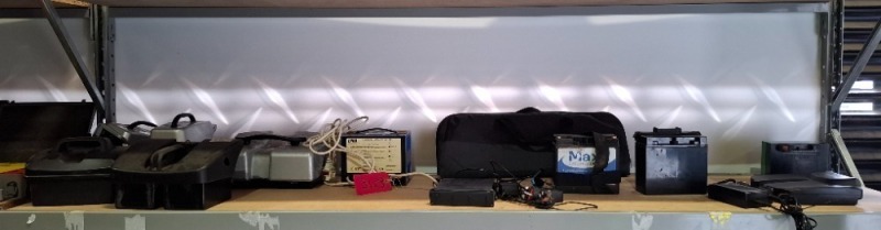 30 X MIXED MOBILITY SCOOTER PARTS LOT CONTAINING DMA AUTOMATIC CHARGING SYSTEM , MAXI BATTERIES , WHEELCHAIR FOOTRESTS , HI POOL MOTORS ETC OVER 2 SHELVES