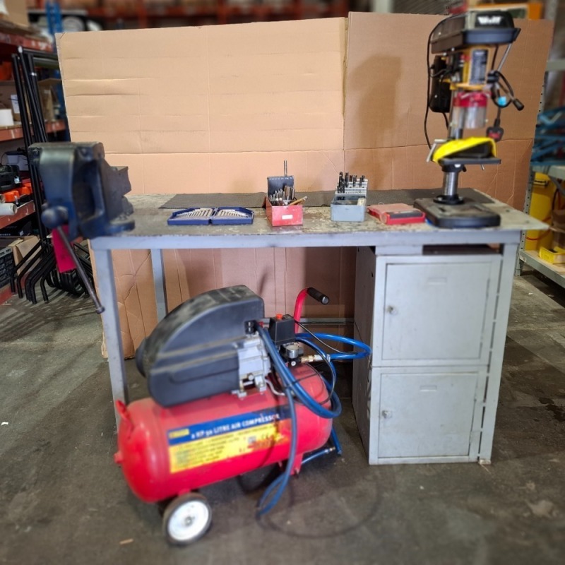 3 X PIECE LOT CONTAINING METAL TABLE WITH HEAVY DUTY BENCH VICE , 1 X WOLF ENGINEER'S PILLAR DRILL 230V , 1 X MARKSMAN 2 HP 50 LITRE AIR COMPRESSOR , AND SOME DRILL BITS