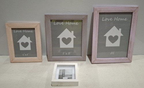 600 + WOODEN PHOTO FRAMES IN SIZES A4 , 10 x 8 INCH 6 X 4 INCH AND 15 X 15 CM IN VARIOUS COLOURS PINK , GREEN , IVORY , YELLOW ETC OVER 4 PALLETS (NOTE AGED PRODUCT - BOXES HAVE MUSTY ODOUR - SEE IMAGE FOR REPRESENTATIVE SAMPLE )