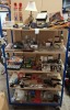 100+ MIXED LOT CONTAINING JUMP LEADS , SOUDAL GAS FILLING EXPANDING FOAM , STAINLESS STEEL MEASURING SHOT GLASSES , MEBUS LED USB LIGHTS IN BLACK AND WHITE , LIGHTERS , TABLE LAMP ETC OVER 5 SHELVES.