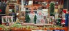 FULL BAY MIXED CHRISTMAS LOT CONTAINING LIGHT UP ACRYLIC SNOWMAN , 1.5 FLOCKED WILLOW TREE 540 LEDS , 62 CM TWISTED DREAMLIGHTS LIT SNOWMAN , PLATFORM 53 CLASSIC TRAIN SET , PREMIER ANIMATED SINGING DINOSAURS , 90CM TWINKLING STARBURST SNOWFLAKE , ETC