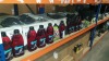APPROX 150 PIECE LOT CONTAINING APPROX 100 X TESCO MOTORCYCLE OIL (2 STROKE), VARIOUS BIKE ACCESSORIES IE SADDLE BAGS, GRIPS, BRAKE ARMS, ALLOY PROPSTAND ETC - ON ONE SHELF