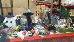 60+ PREMIER DECS HALLOWEEN ITEMS ON A FULL SHELF IE. FRANKENSTEIN MASK, GHOUL CLOWN MASK, FLASHING EYES ZOMBIE GNOME, NOVELTY HEADBANDS, SPIDER, SKULL LIGHTS, HAUNTED PORTRAIT, DROPPING SPIDER, WITCHES HAT, PROJECTOR ETC