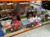 APPROX 100+ PIECE ASSORTED BRAND NEW PREMIER CHRISTMAS LOT CONTAINING 60CM TREE POT, VARIOUS LED CANVAS'S, RIBBONS, 90CM SOFT ACRYLIC FLASHING GUITAR, LED CANDLES, 62CM BROWN WICKER HARE, 31CM LED TREE, VARIOUS TREE AND HOUSE DECORATIONS ETC - ON ONE SHEL