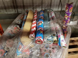 FULL PALLET CONTAINING APPROX 150+ ROLLS OF DOUBLE SIDED (DIFFERENT DESIGNS) WRAPPING PAPER IE. PURPLE SANTA AND PALS, WHITE SNOWFLAKE, LET IT SNOW AND HOHOHO FLYING SANTA ETC.