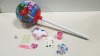 60 X BRAND NEW HUGE SURPRISE LOLLY CONTAINING STICKERS, SOFT TOY, FLUORESCENT STICKS, SLIME AND MINI JIGSAW PUZZLE. - IN 10 BOXES