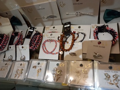 55 ITEMS OF RIVER ISLAND COSMETIC JEWELLERY & SUNGLASSES (SALE PRICE MARKED UP AS €5-€7 EACH TOTAL MIN €300) IE. EARRING SETS, BANGLES, NECKLACES, SCARF PINS ETC.