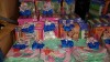 80+ PIECE ASSORTED TOY LOT CONTAINING TROLLS MAKE YOUR OWN HAIR ACCESSORIES, DISNEY PRINCESS BAGS, PJMASKS FINGER PAINT SET, 3 PACK COLOUR YOUR OWN BAG SET, PAINT YOUR OWN MONEY BANK ETC - IN HALF A BAY