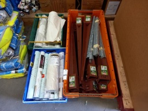 3 X TRAYS OF MIXED HARDWARE TO INCLUDE - 13 X 100MM X 750MM FENCE ANCHOR'S, APPROX 100 X STEEL WALL BRACKETS, APPROX 25 ROLLS OF VARIOUS WALLPAPER AND 2 X (DIALL) DUST SHEETS.