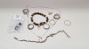12 PIECE LOT CONTAINING 6 X VARIOUS RINGS, EARRINGS, 2 X BRACELET, 1 X SILVER COLOURED NECKLACE WITH CROSS AND 1 X WOODEN JEWELLERY BOX