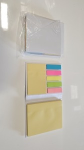 104 X DESK BUDDY POST IT HOLDERS - WITH 2 YELLOW POST IT STYLE PADS AND 5 PADS OF COLOURED PAGE