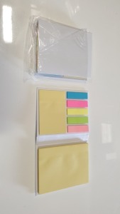 104 X DESK BUDDY POST IT HOLDERS - WITH 2 YELLOW POST IT STYLE PADS AND 5 PADS OF COLOURED PAGE