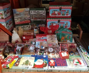 LARGE QUANTITY ASSORTED CHRISTMAS LOT CONTAINING JIGSAWS, DECORATE YOUR OWN WOODEN CHRISTMAS TREE AND SLEIGH, GLITTER CHRISTMAS PUZZLES, VARIOUS BOOKS, 12 CRAFT MAKES OF CHRISTMAS, PENCILS WITH ERASERS, PHOTO BAUBLES, WRAPPING PAPER, CHRISTMAS STORAGE BOX