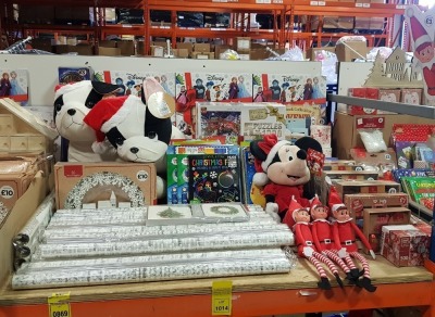 LARGE QUANTITY ASSORTED CHRISTMAS LOT CONTAINING LARGE FESTIVE FRIENDS SOFY TOY DOG, WRAPPING PAPER, STORY BOOK COLLECTION ADVENT CALENDER, LIGHT UP GLITTER VILLAGE, VARIOUS BOOKS, MICKY MOUSE SOFT TOY, LUXURY PINE CONE, STICKERS, ELF, PUZZLES ETC