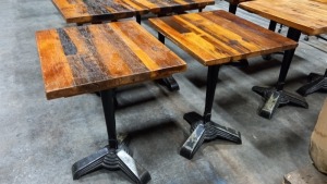 2 X CAST IRON BASED WOODEN TABLES (70X60CM)