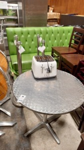 7 PIECE ASSORTED LOT CONTAINING 1 X 3 SEATER GREEN SOFA, 1 X DELONGHI 4 SLICE TOASTER, 1 X STAINLESS STEEL CIRCULAR TABLE (80CM) AND 4 X STAINLESS STEEL QUEUE ROPE HOLDERS.